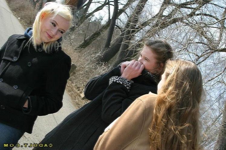 16P Three cute playful lesbians walking in the park
