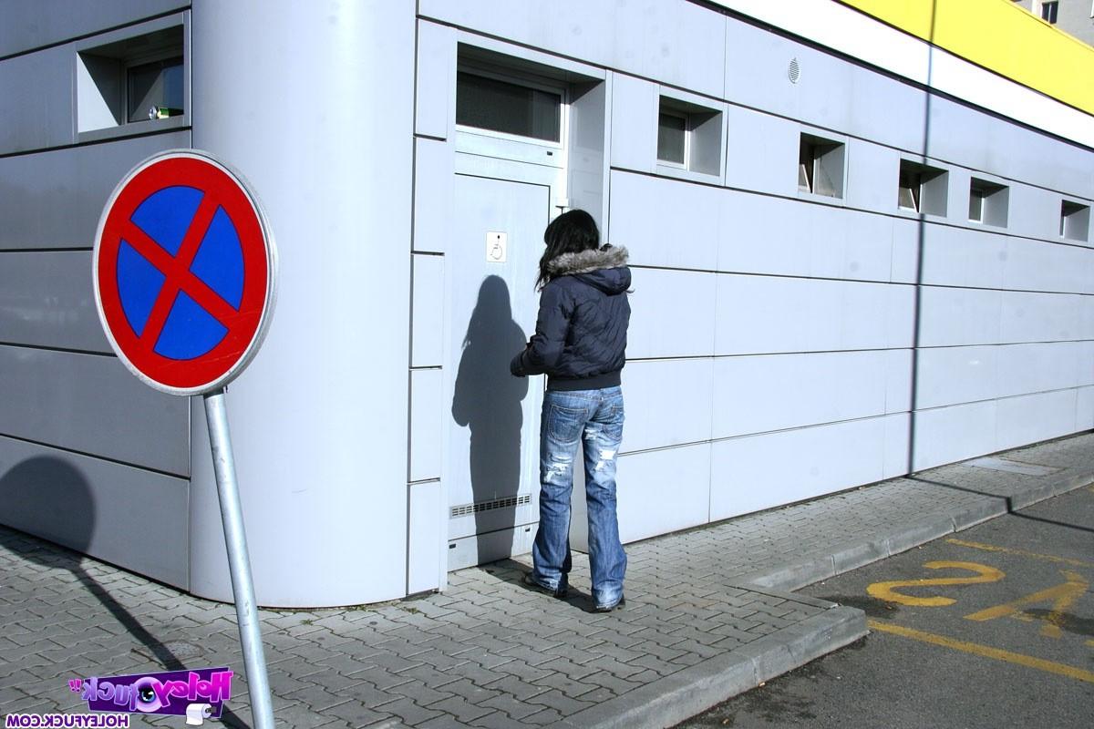 13P Brunette girl sucking a stiffy penis on a public toilet