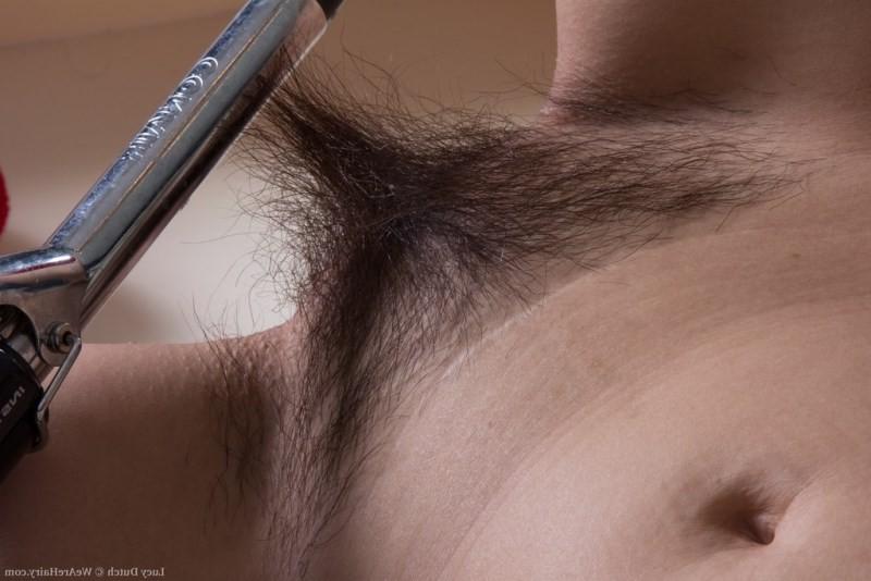 15P Sexy Lucy Dutch strips and combs her hairy pussy