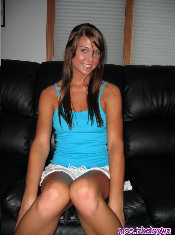 16P SweetAdri on the couch with a blue top and white skirt