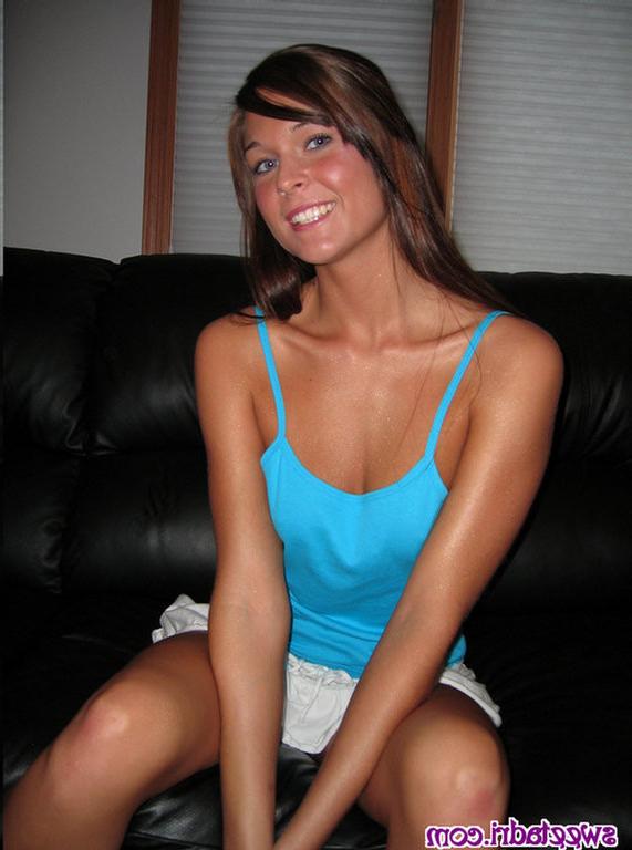 16P SweetAdri on the couch with a blue top and white skirt
