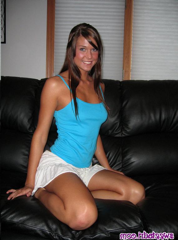 16P SweetAdri on the couch with a blue top and white skirt