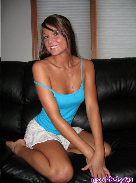16P SweetAdri on the couch with a blue top and white skirt