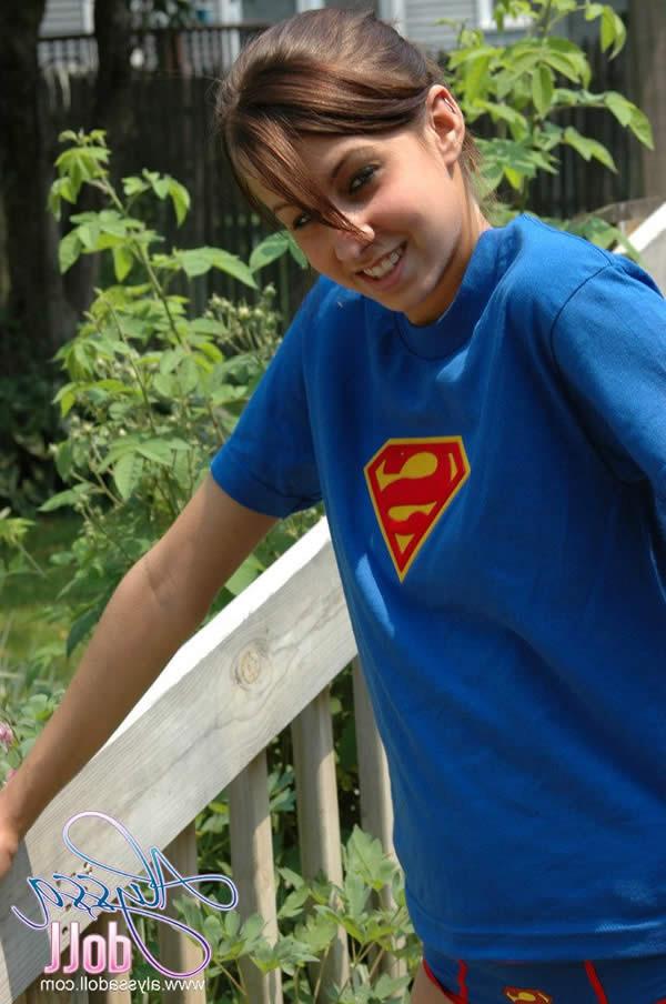 15P Brunette teen alyssa doll in superman panties flashes her tits
