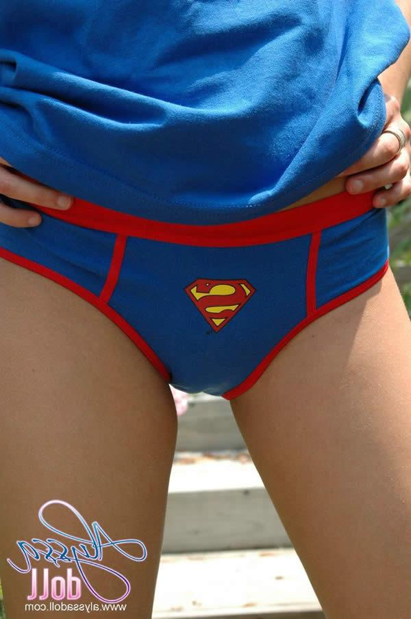15P Brunette teen alyssa doll in superman panties flashes her tits