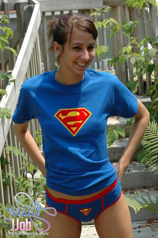 15P Brunette teen alyssa doll in superman panties flashes her tits