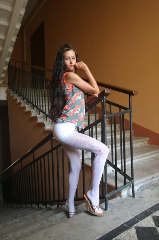 15P Young brunette teen posing in stairwell