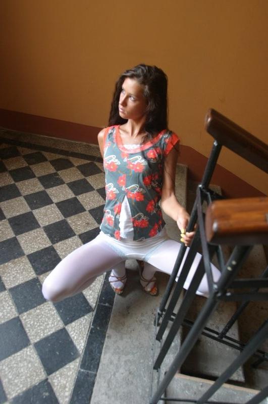 15P Young brunette teen posing in stairwell