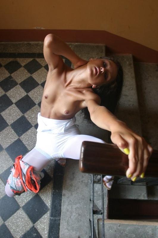 15P Young brunette teen posing in stairwell