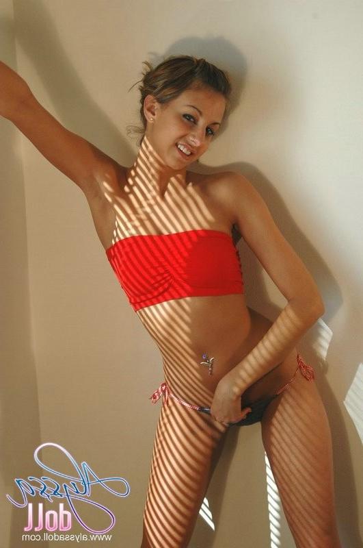 15P Cute Alyssa posing in red top and denim thong