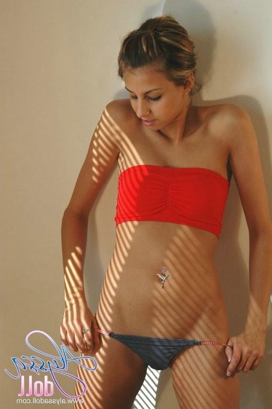 15P Cute Alyssa posing in red top and denim thong