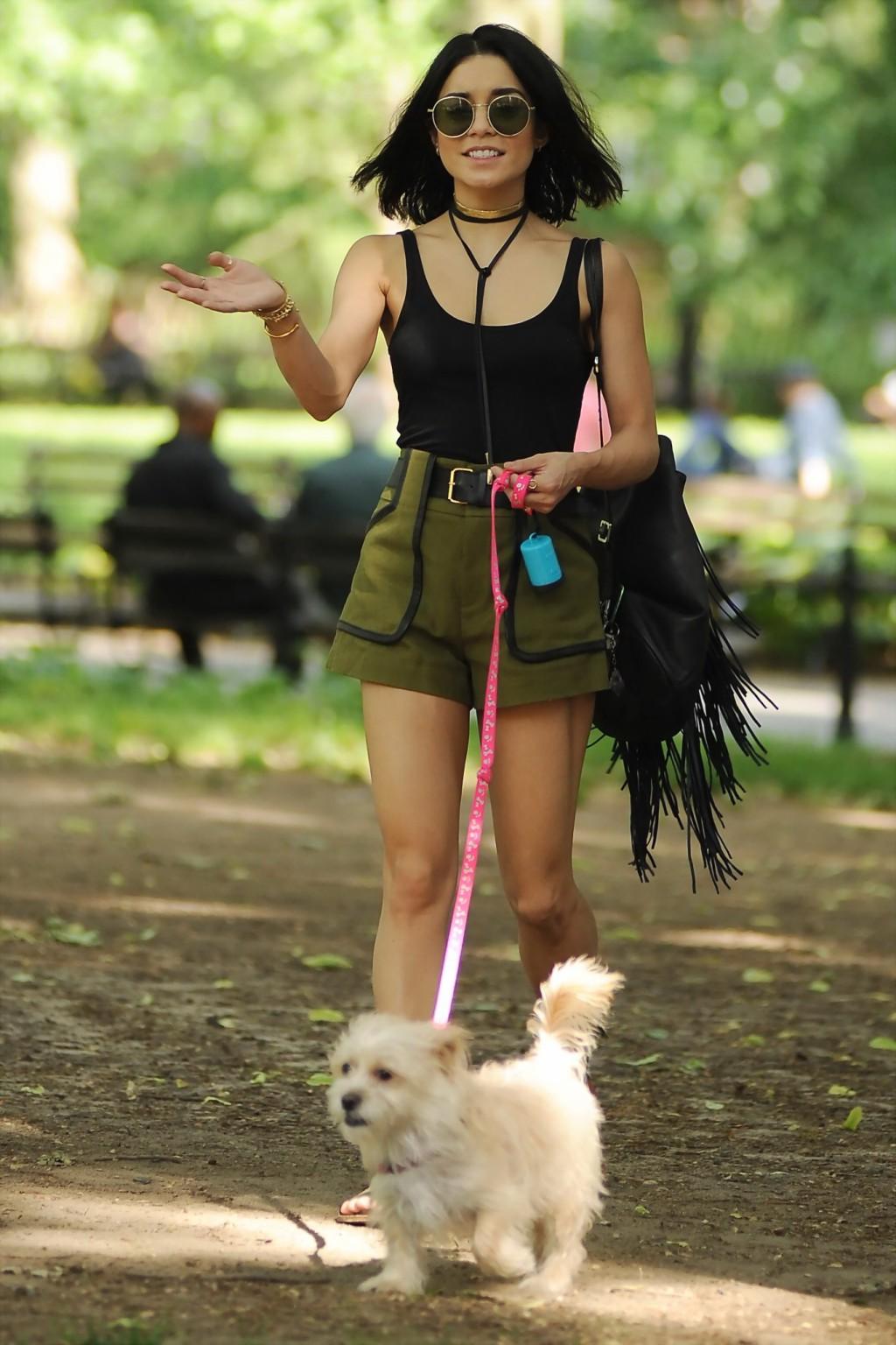 16P Vanessa Hudgens in a tiny black tank top and shorts takes her dog at a park in N