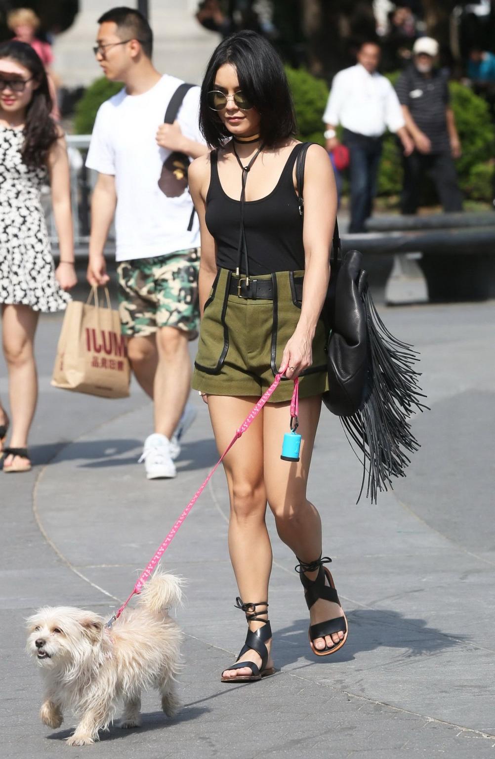 16P Vanessa Hudgens in a tiny black tank top and shorts takes her dog at a park in N