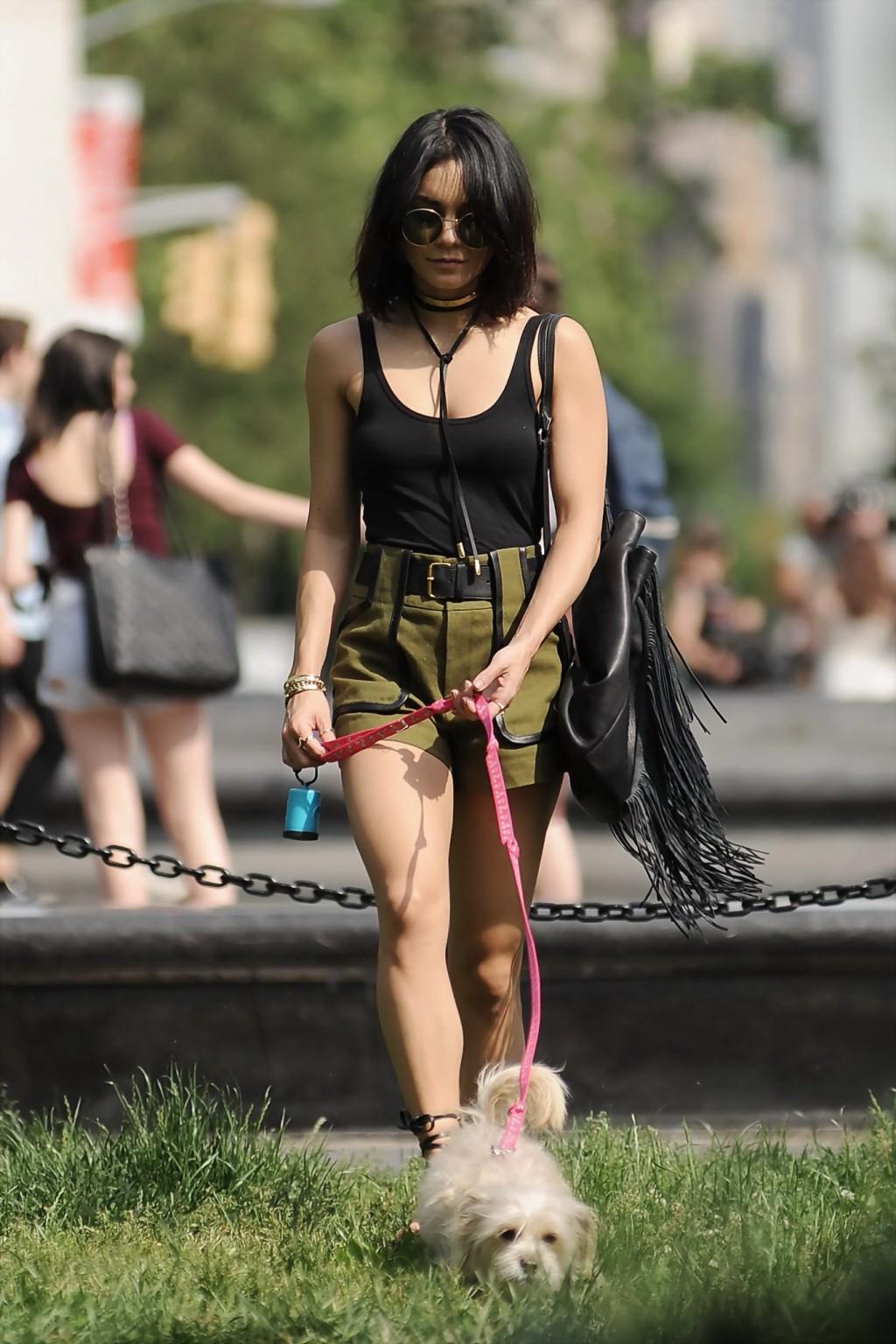 16P Vanessa Hudgens in a tiny black tank top and shorts takes her dog at a park in N