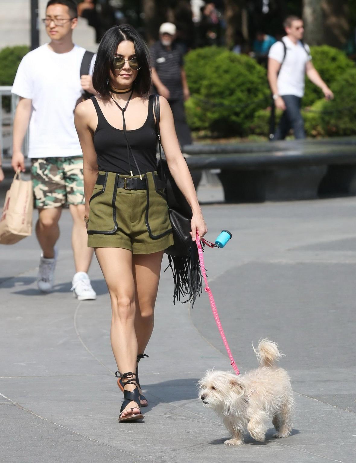 16P Vanessa Hudgens in a tiny black tank top and shorts takes her dog at a park in N