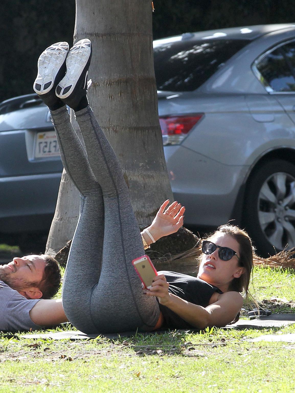 16P Alessandra Ambrosio shows off her ass in tights while working out at a park in S