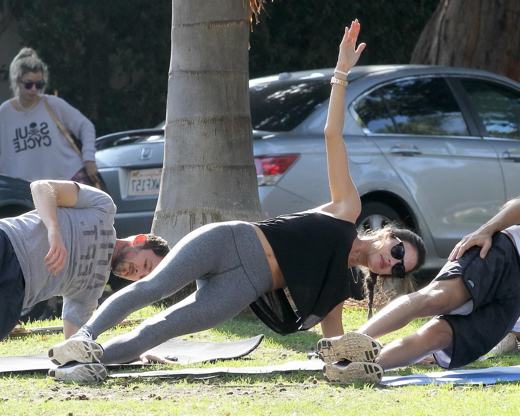 16P Alessandra Ambrosio shows off her ass in tights while working out at a park in S