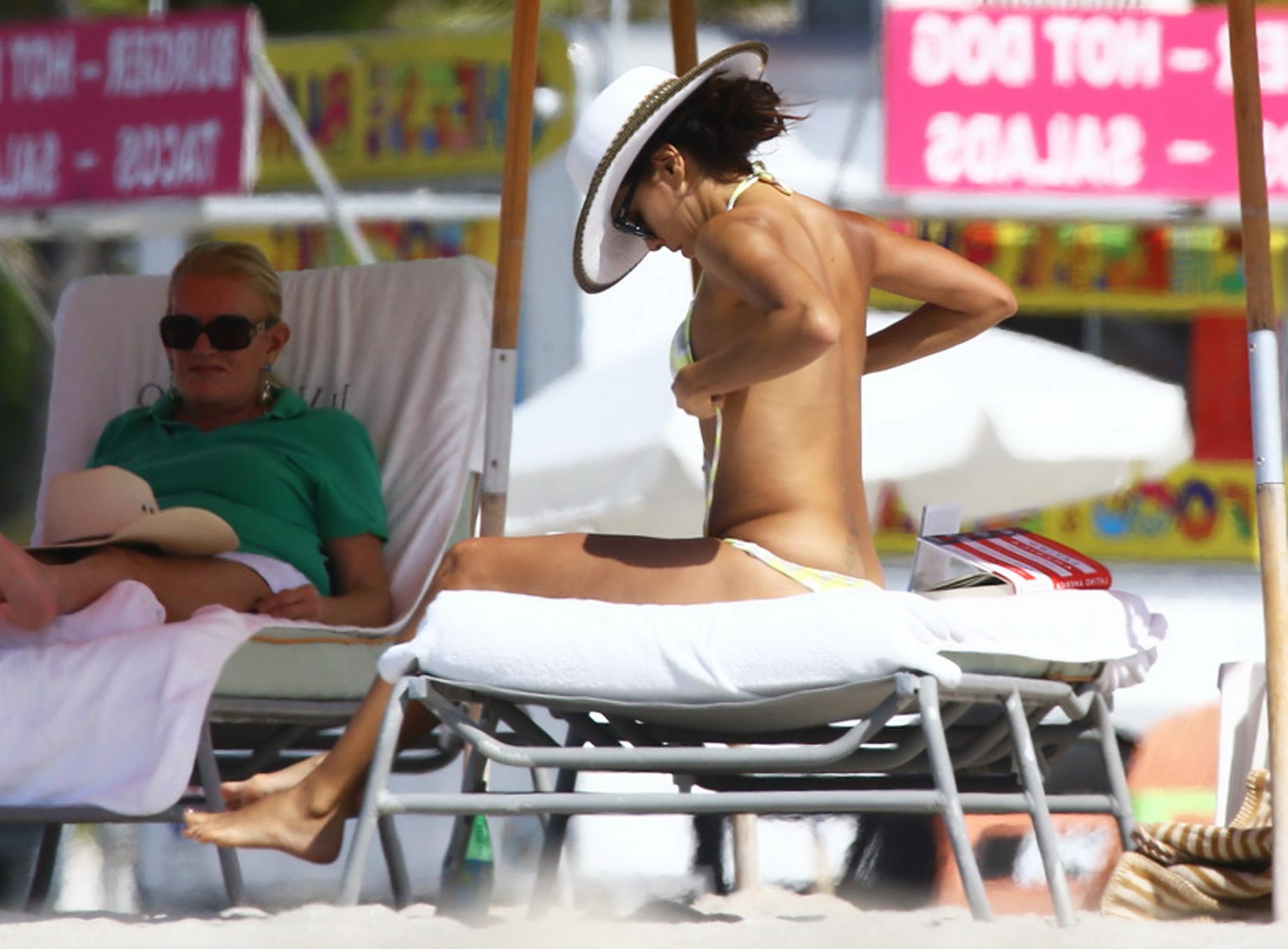 16P Eva Longoria shows her ass and cameltoe while tanning topless at the beach in Mi