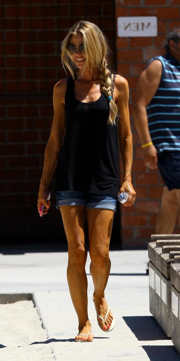 10P Denise Richards wearing a tenk top and a denim shorts out at Coldwater Park in B