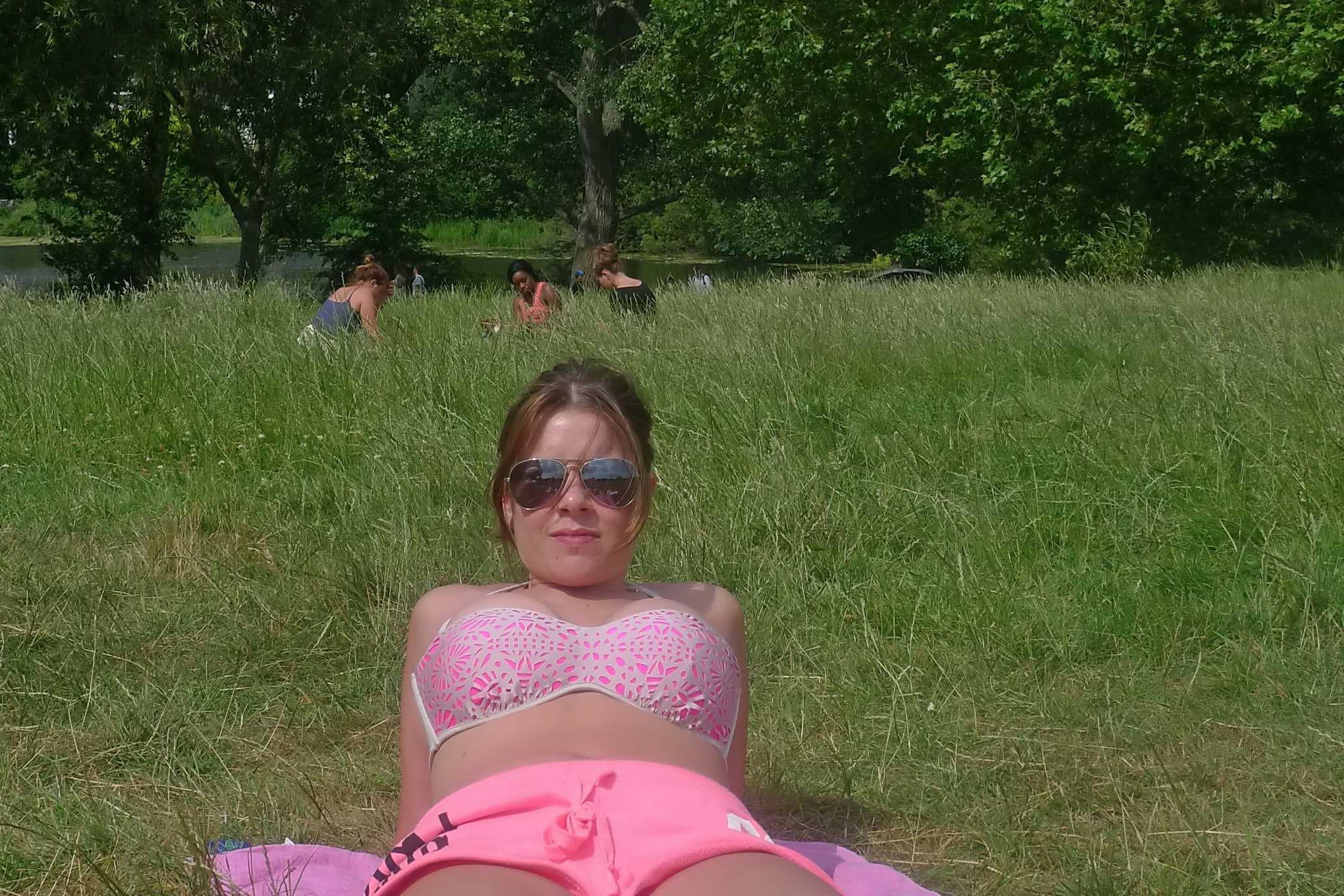 16P Imogen Thomas tanning in her skimpy pink lingerie and shorts at the park in Lond