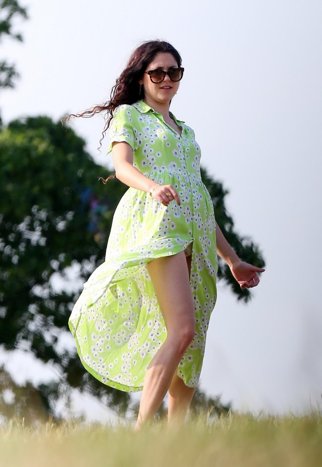 16P Eliza Doolittle upskirt wearing wide open green floral dress at the park in Lond
