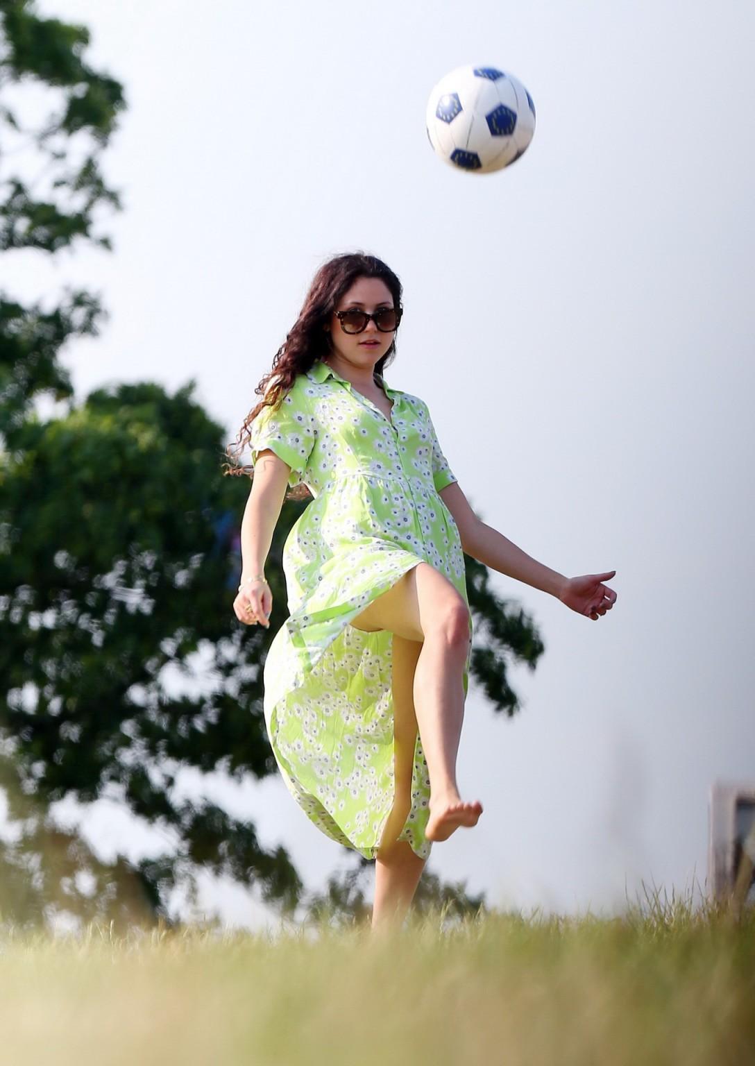 16P Eliza Doolittle upskirt wearing wide open green floral dress at the park in Lond