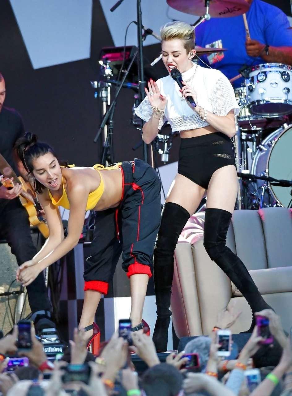 16P Miley Cyrus showing long legs and nice butt on stage