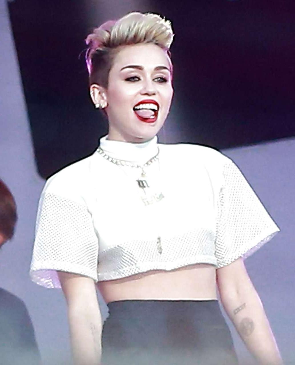 16P Miley Cyrus showing long legs and nice butt on stage