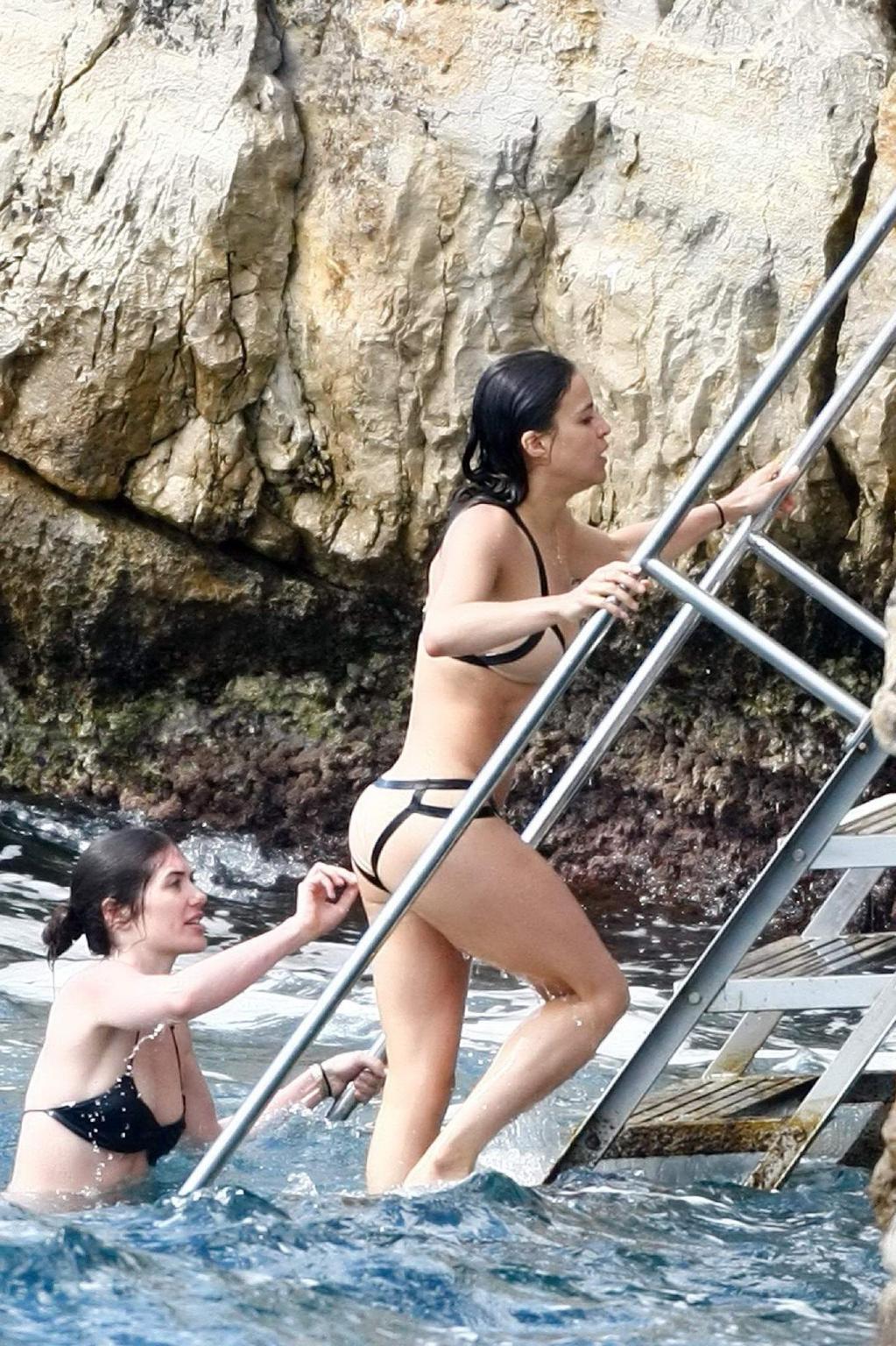 8P Michelle Rodriguez shows pokies  cameltoe wearing a skin colored bikini in Canne