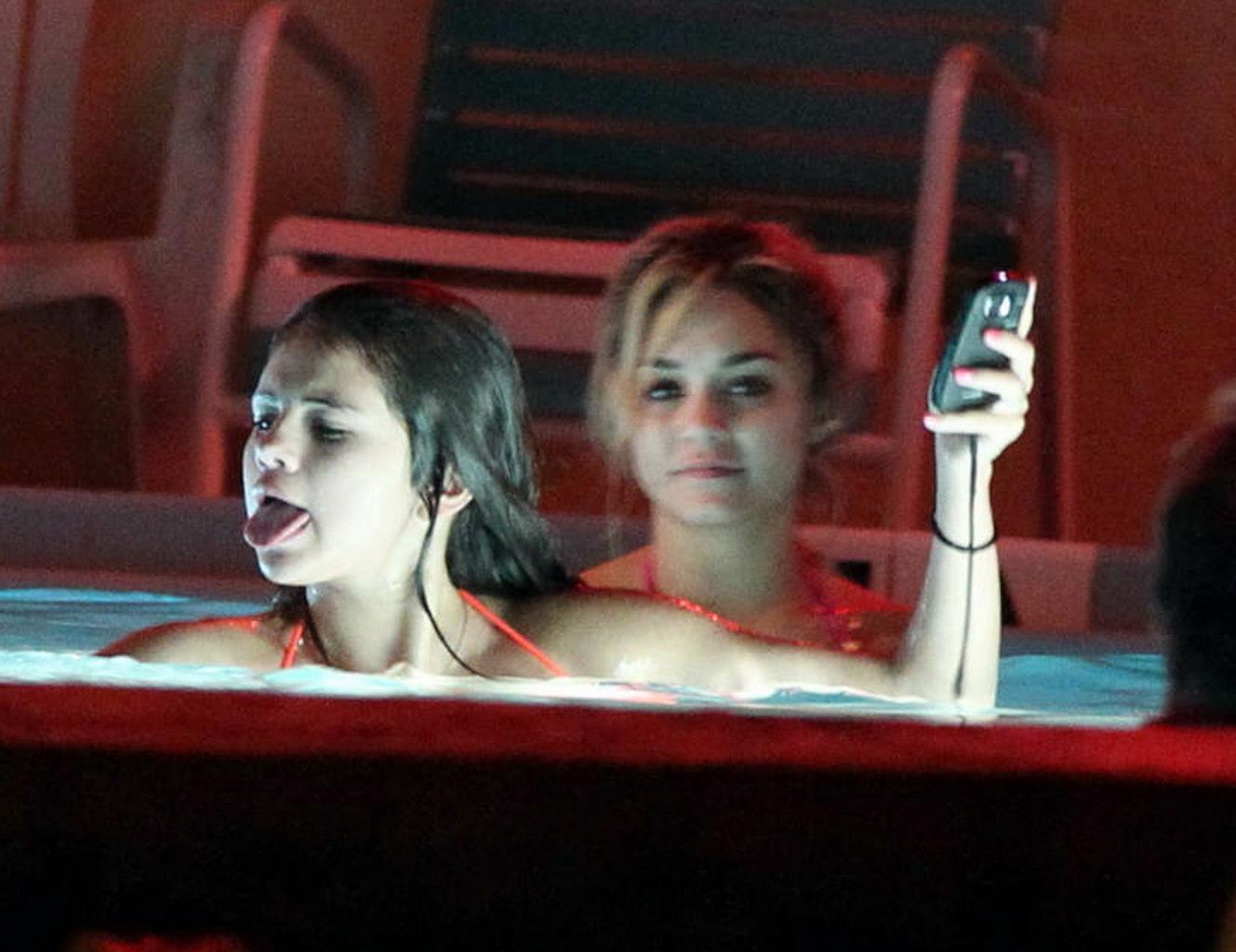 16P Selena Gomez shows cameltoe wearing bikini at the pool on 'Spring Breakers' set