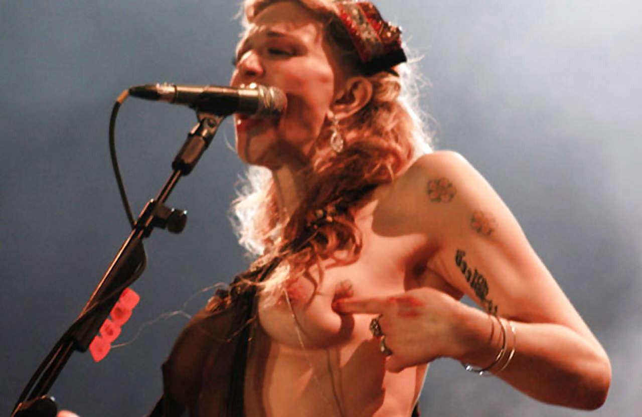 16P Courtney Love stripping down to topless and show tits on stage