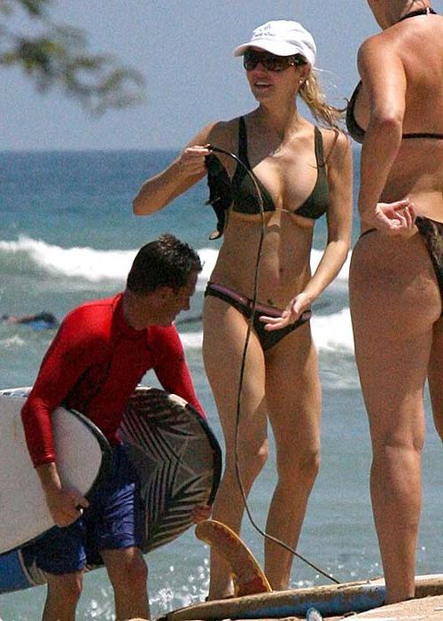 16P Heather Locklear exposing her sexy body and hot ass in bikini on beach