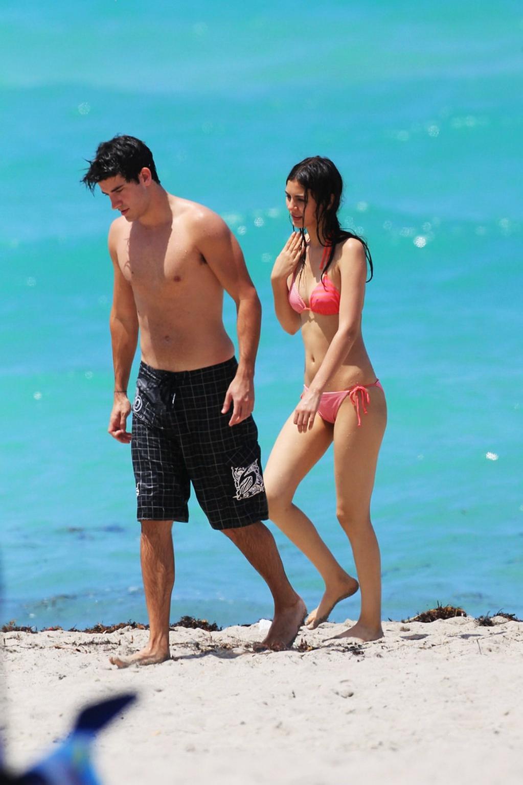 16P Victoria Justice shows cameltoe wearing wet bikini on a beach in Florida