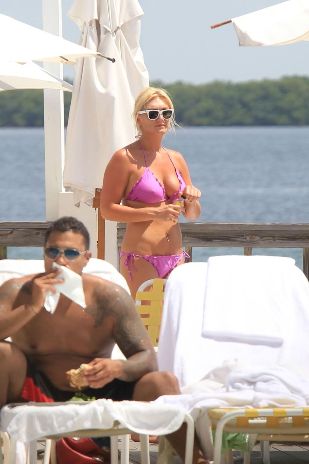 16P Brooke Hogan nude in cage for new PETA ad campaign