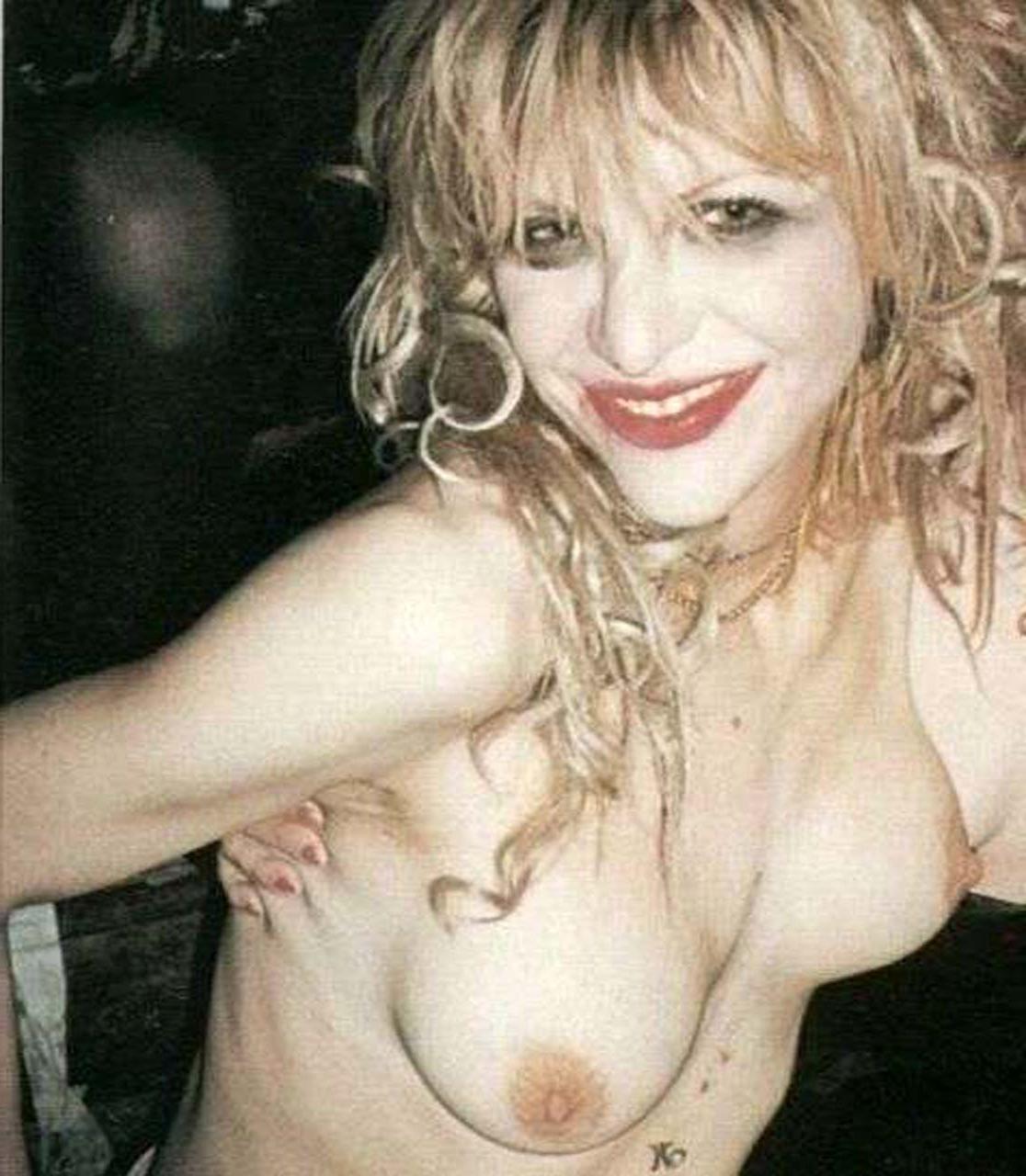 10P Courtney Love showing her nice boobs and posing sexy in bikini paparazzi picture