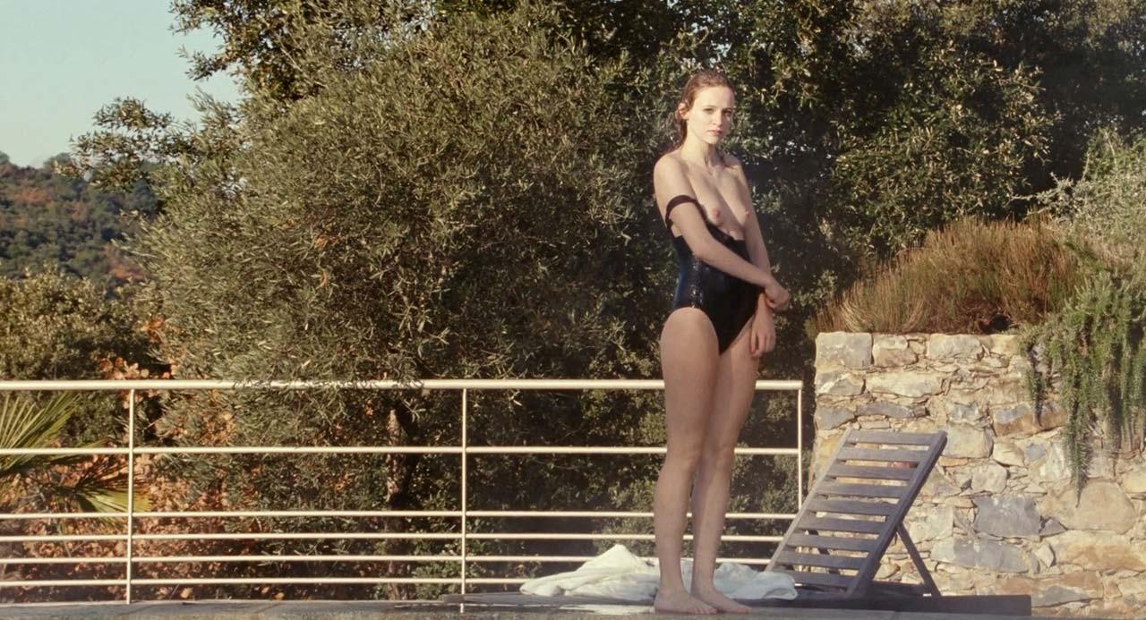 10P Christa Theret exposing her nice big tits by the pool in nude movie scenes