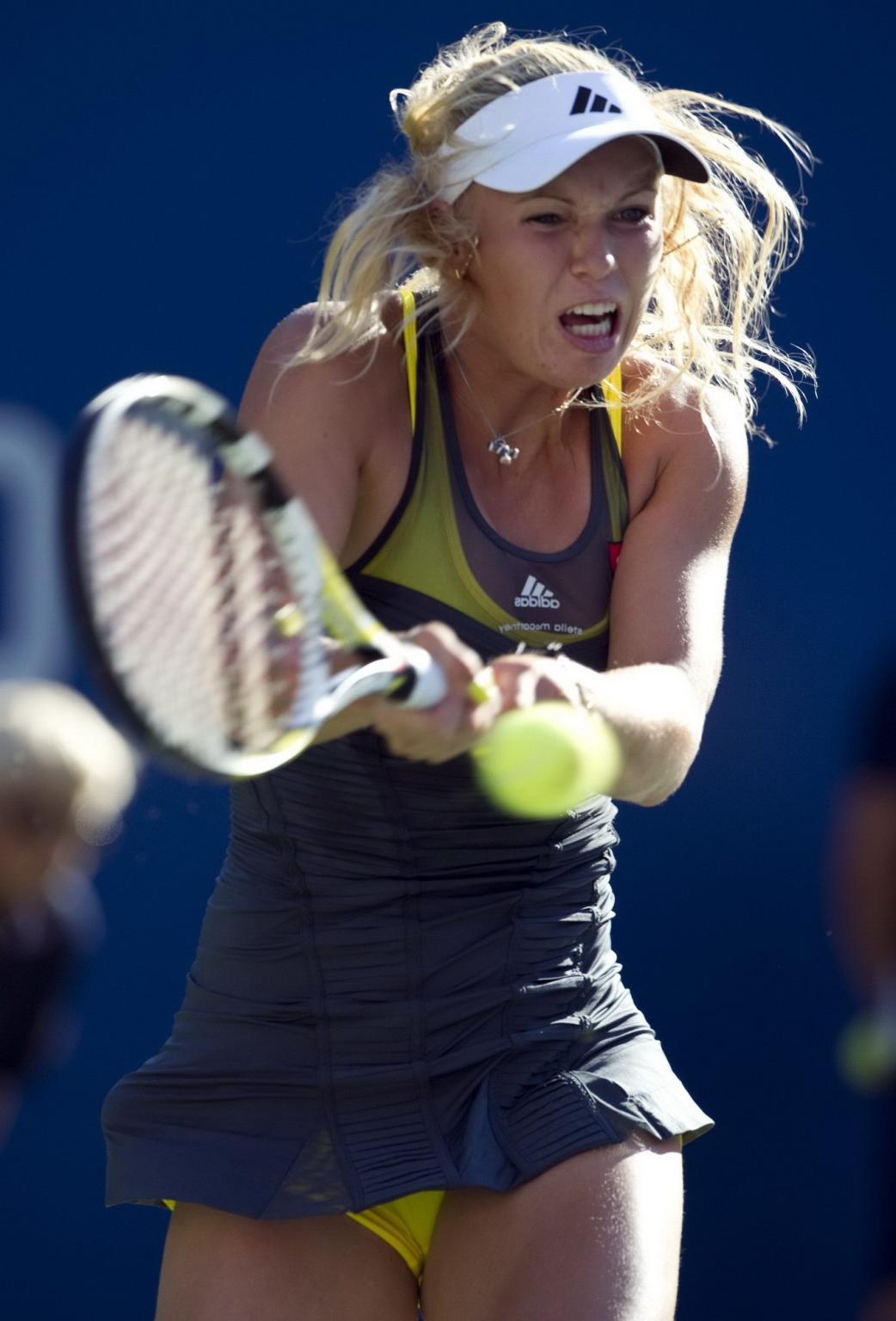 15P Caroline Wozniacki showing cameltoe in sweaty yellow panties at The US Open
