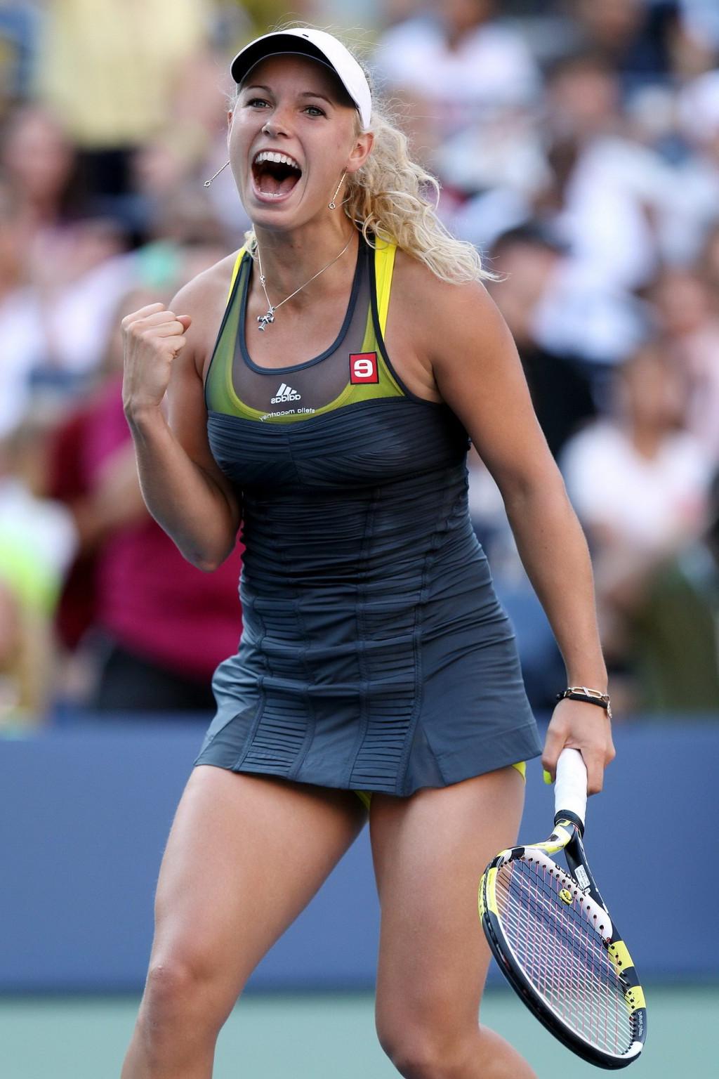 15P Caroline Wozniacki showing cameltoe in sweaty yellow panties at The US Open