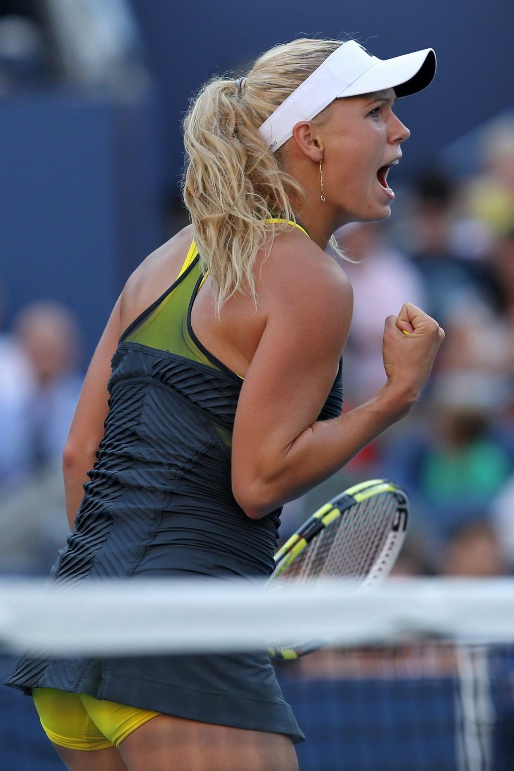 15P Caroline Wozniacki showing cameltoe in sweaty yellow panties at The US Open