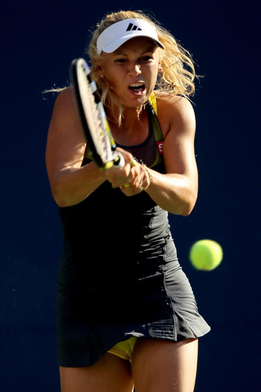 15P Caroline Wozniacki showing cameltoe in sweaty yellow panties at The US Open