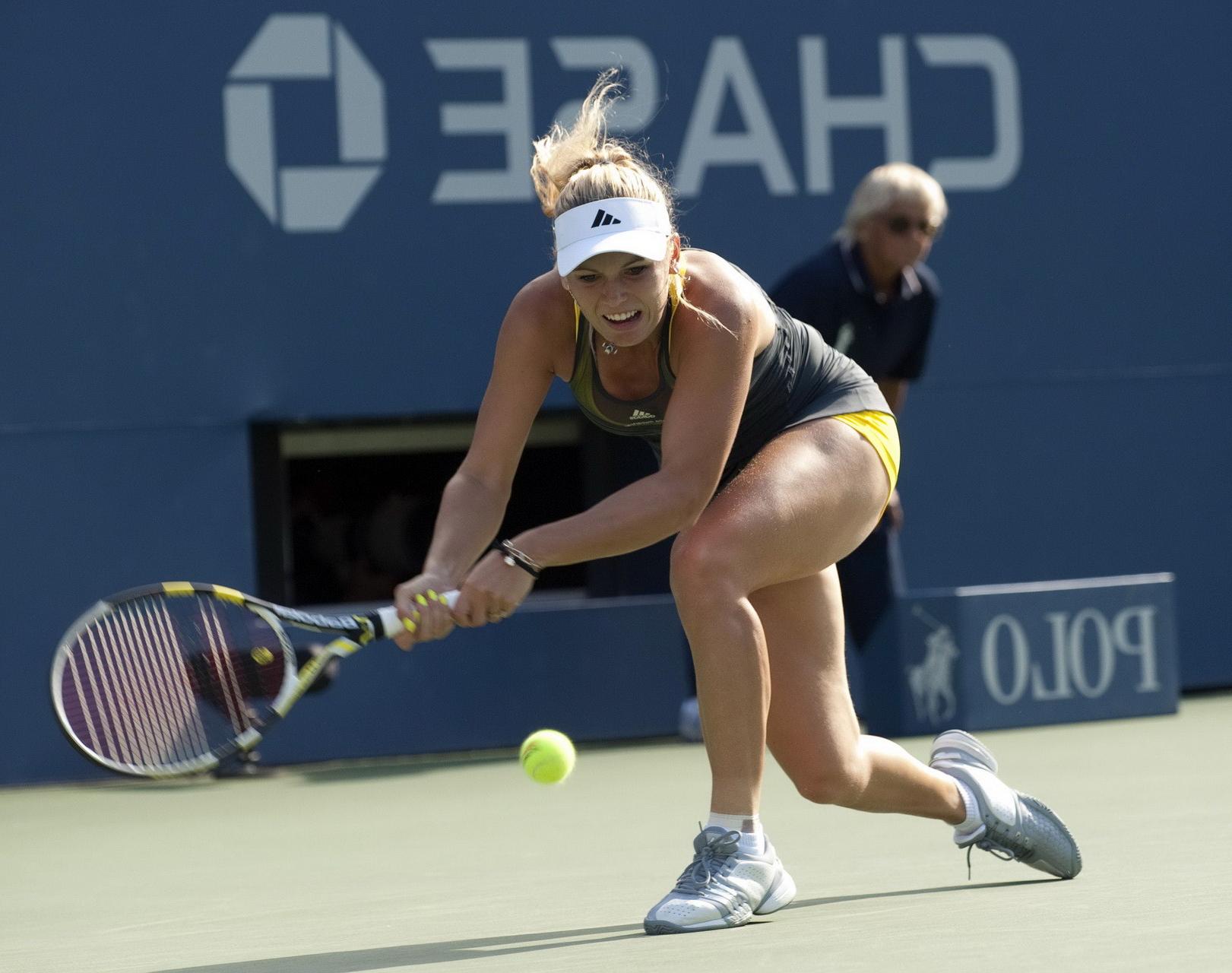 15P Caroline Wozniacki showing cameltoe in sweaty yellow panties at The US Open