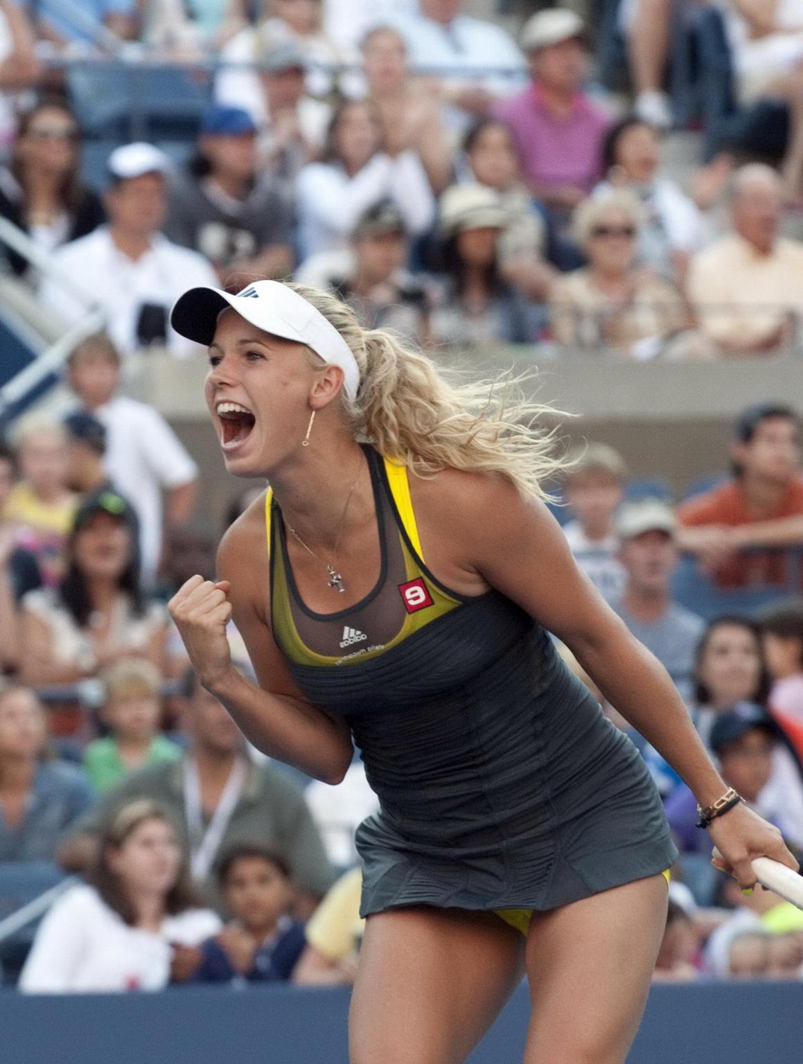 15P Caroline Wozniacki showing cameltoe in sweaty yellow panties at The US Open