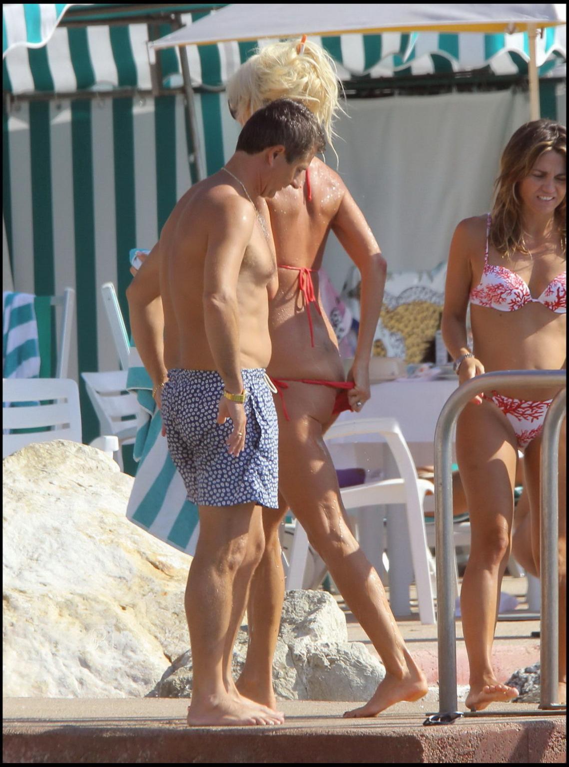15P Victoria Silvstedt showing cameltoe in skimpy wet bikini at Monte Carlo Beach Cl