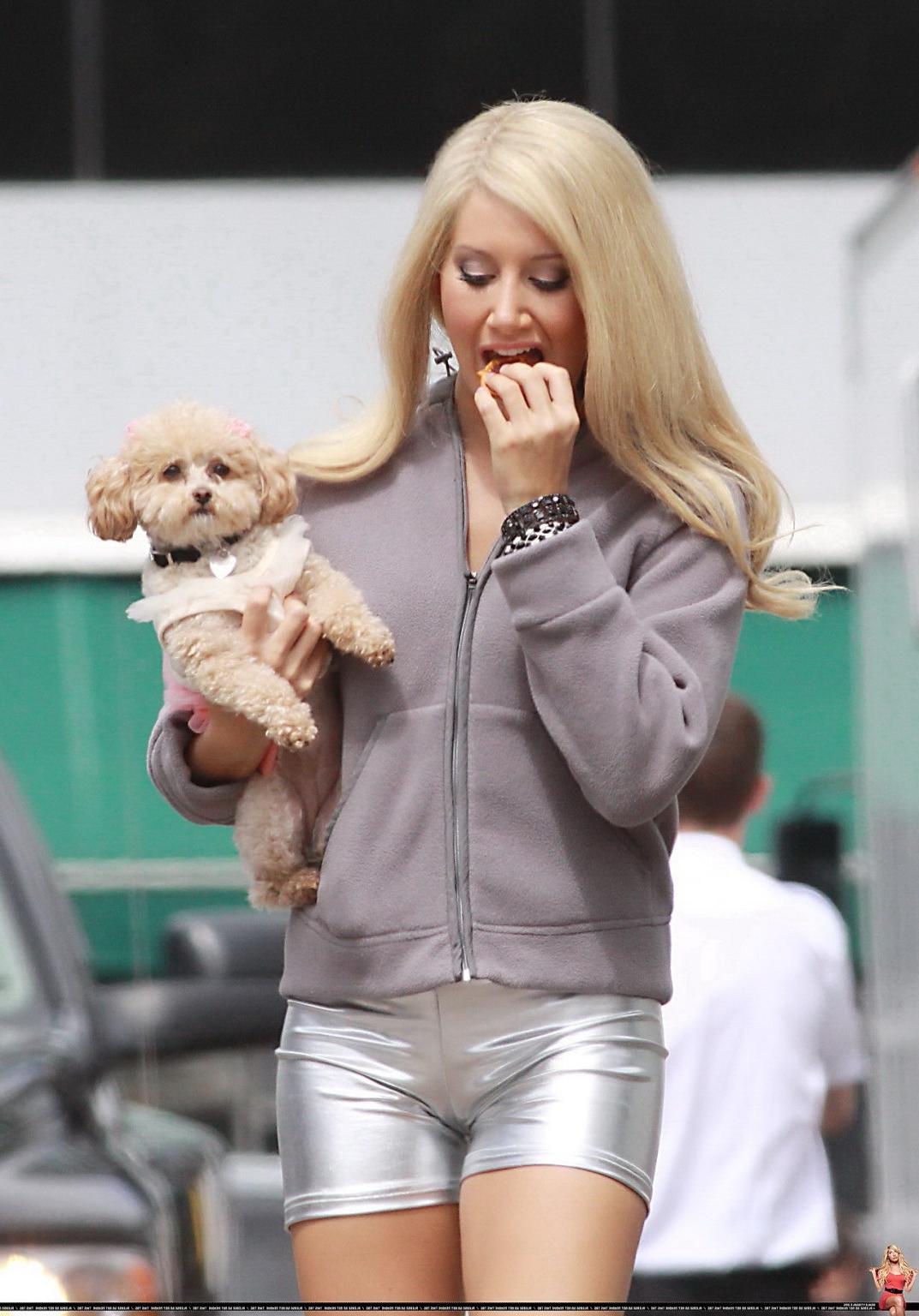 16P Ashley Tisdale showing cameltoe in tight silver shorts on the set