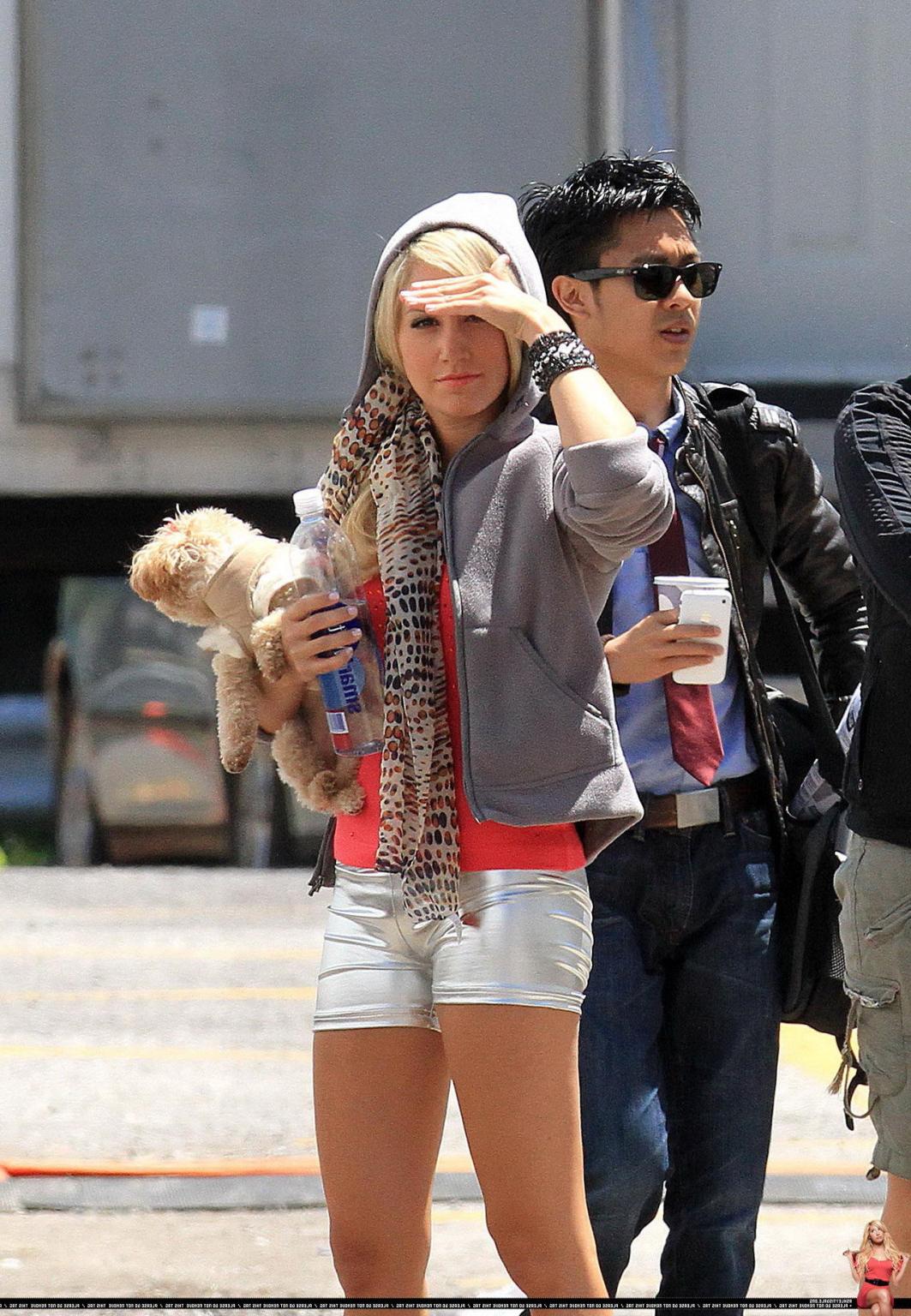 16P Ashley Tisdale showing cameltoe in tight silver shorts on the set