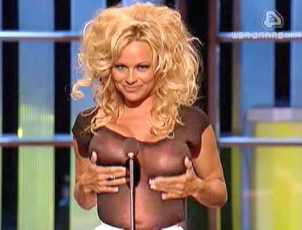 16P Pamela Anderson exposing her sexy body and fucking huge boobs