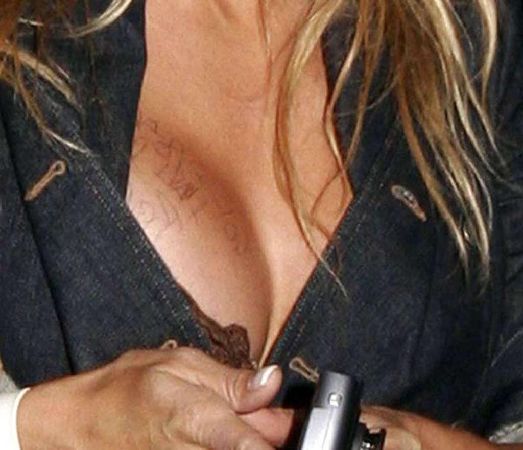 16P Pamela Anderson exposing her sexy body and fucking huge boobs