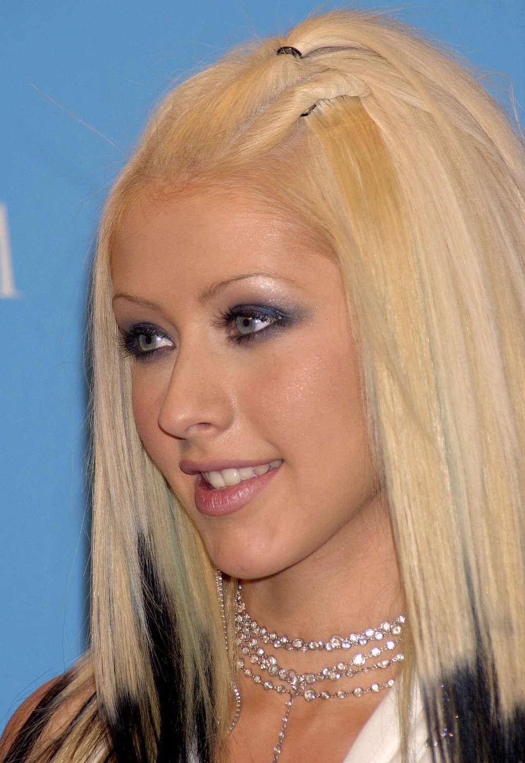 10P Christina Aguilera with long blonde hair and showing her pussy and ass