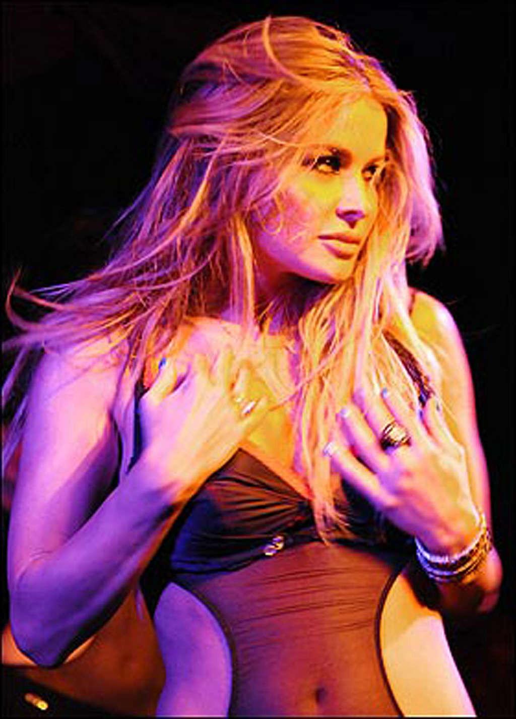 16P Carmen Electra performing striptease in her bedroom on a very sexy way