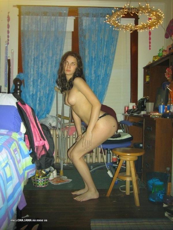 10P Brunette babe posing topless in her bedroom